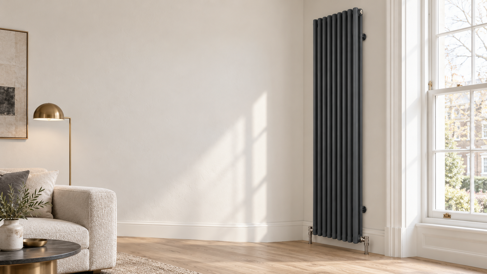 Anthracite vertical two-column radiator beside a sash window in a modern British living room